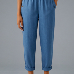 Beige women's trousers by THE WHITMORE FAMILY with elastic waistband and side pockets, casual and comfortable fit.