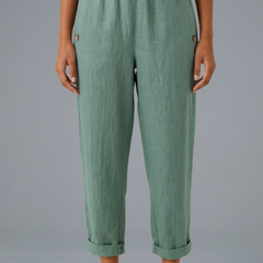 Beige women’s trousers with elastic waistband and side pockets from THE WHITMORE FAMILY, casual and comfortable fit.