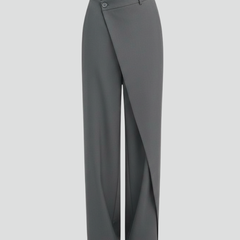 Women's trousers by THE WHITMORE FAMILY featuring an asymmetric front design and straight-leg style, shown in the image.