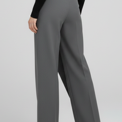 Women’s trousers by THE WHITMORE FAMILY featuring an asymmetric front and straight-leg design, shown in a stylish fit.
