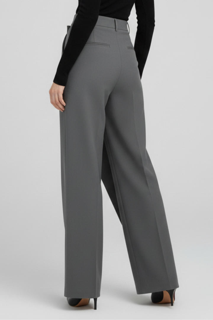 Women’s trousers by THE WHITMORE FAMILY featuring an asymmetric front and straight-leg design, shown in a stylish fit.