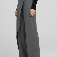 Women's trousers with asymmetric front design and straight legs by THE WHITMORE FAMILY, shown on a model.