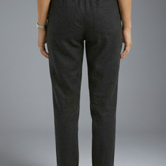 Women’s trousers with elasticated waistband and drawstring by THE WHITMORE FAMILY, showing comfortable casual fit and soft fabric.