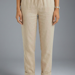 Women’s trousers with elasticated waistband and drawstring, by THE WHITMORE FAMILY, featuring a comfortable and relaxed fit.