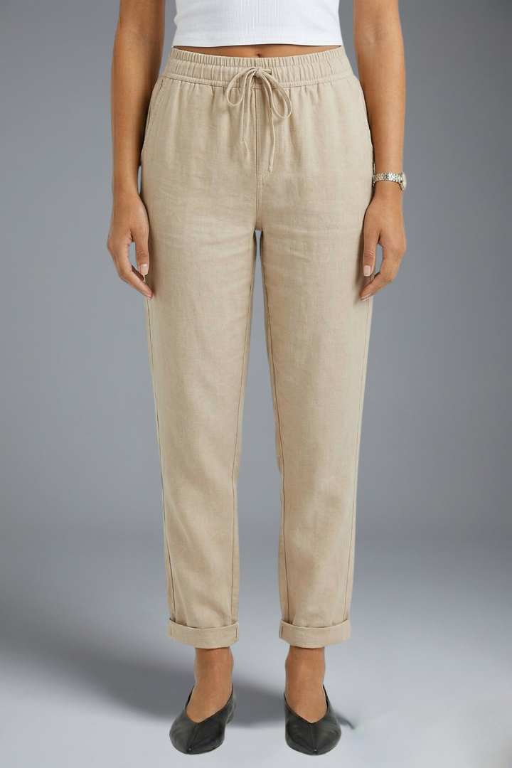Women’s trousers with elasticated waistband and drawstring, by THE WHITMORE FAMILY, featuring a comfortable and relaxed fit.