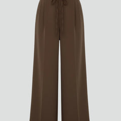 Women’s wide leg trousers with tie waist and high rise from THE WHITMORE FAMILY, featuring a relaxed fit and stylish silhouette.