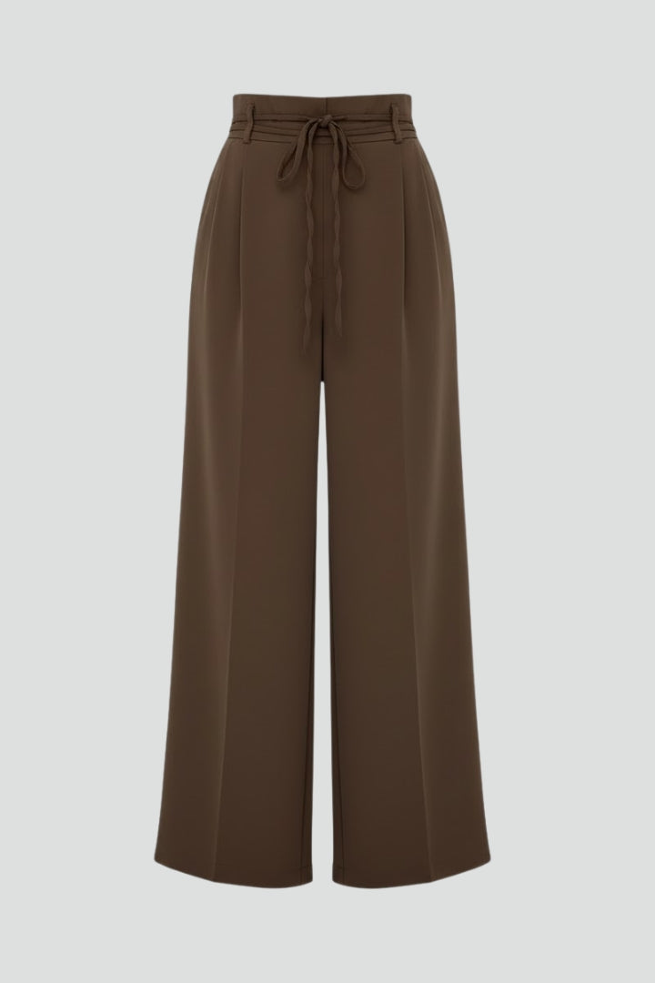 Women’s wide leg trousers with tie waist and high rise from THE WHITMORE FAMILY, featuring a relaxed fit and stylish silhouette.