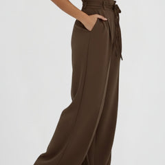 Women's wide leg trousers with tie waist and high rise from THE WHITMORE FAMILY, shown in a stylish, relaxed fit.