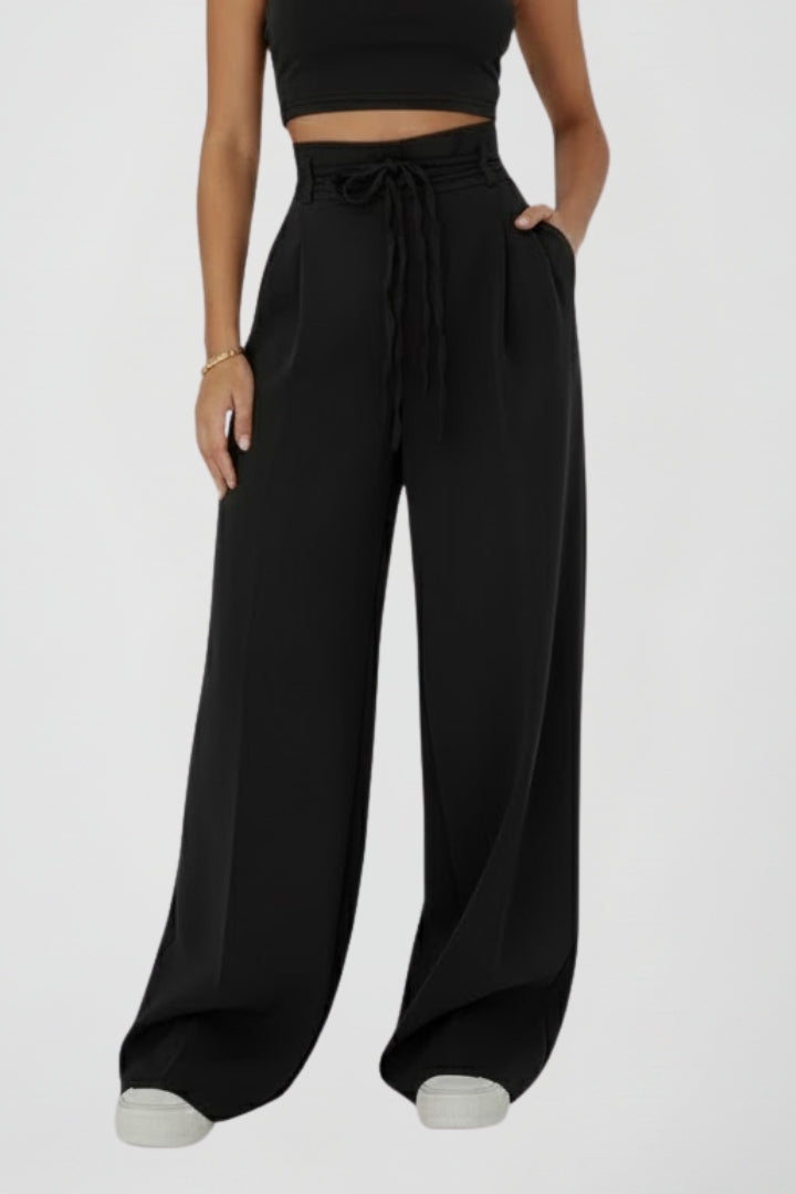 Women’s wide leg trousers with tie waist and high rise from THE WHITMORE FAMILY, shown with relaxed fit and stylish design.
