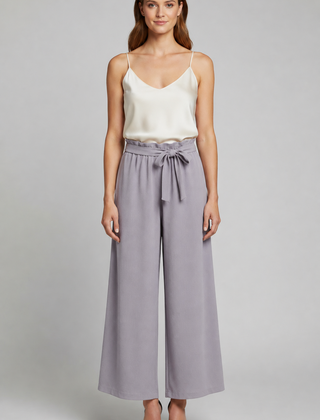Women’s wide-leg trousers with tie waist from THE WHITMORE FAMILY, featuring a relaxed fit and stylish design.