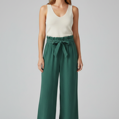 Women’s green trousers with elastic waist and tie belt from THE WHITMORE FAMILY, featuring a comfortable, stylish fit.