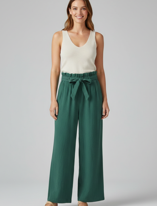 Women’s green trousers with elastic waist and tie belt from THE WHITMORE FAMILY, featuring a comfortable, stylish fit.