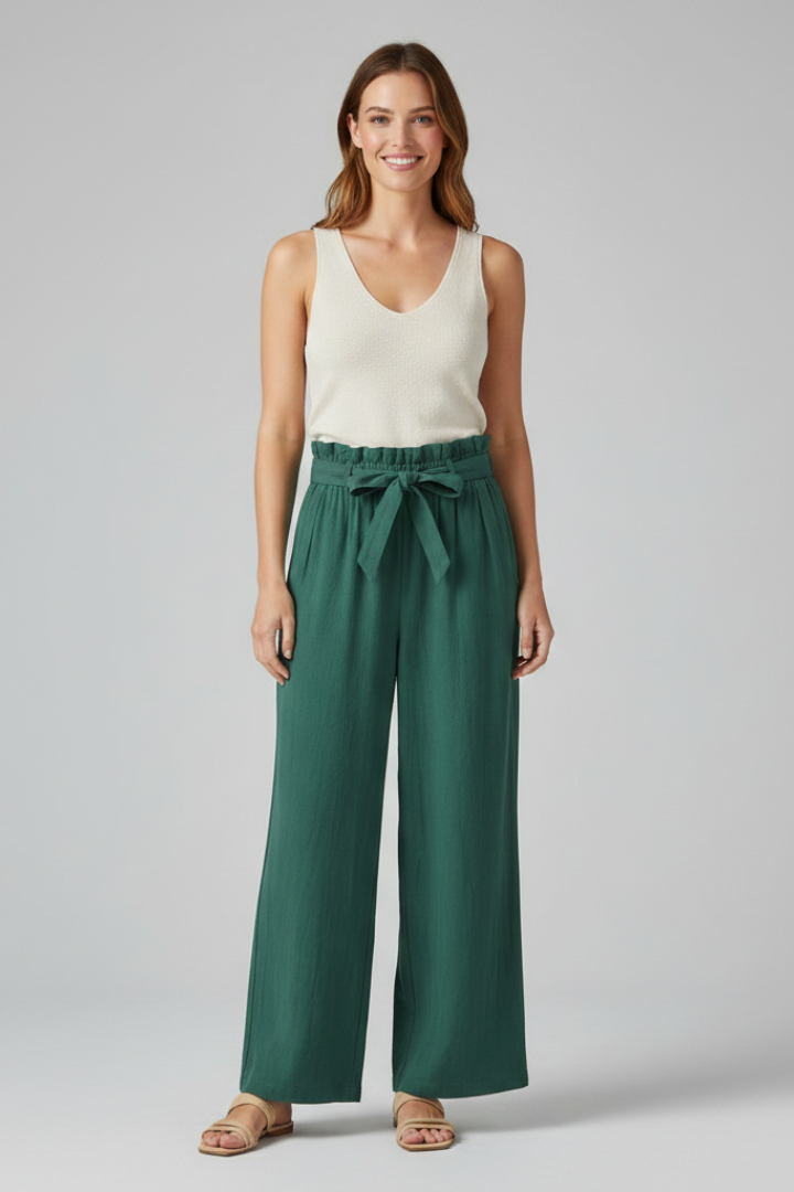Women’s green trousers with elastic waist and tie belt from THE WHITMORE FAMILY, featuring a comfortable, stylish fit.