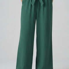 Women's green trousers with elastic waistband and tie belt from THE WHITMORE FAMILY, casual and comfortable fit.