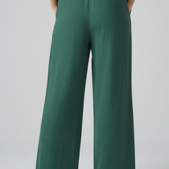 Green women’s trousers from THE WHITMORE FAMILY with elastic waist and tie belt, casual and comfortable fit.