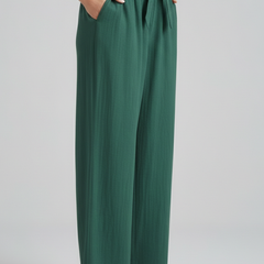 Green women’s trousers by THE WHITMORE FAMILY with elastic waistband and tie belt, tailored fit and casual style.