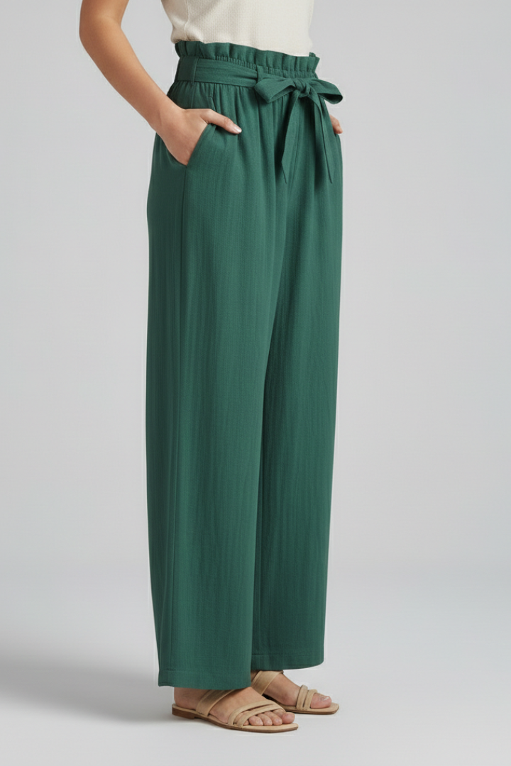 Green women’s trousers by THE WHITMORE FAMILY with elastic waistband and tie belt, tailored fit and casual style.