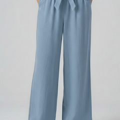 Green women’s trousers with elastic waist and tie belt by THE WHITMORE FAMILY, stylish and comfortable for everyday wear.