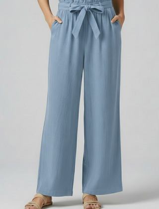 Green women’s trousers with elastic waist and tie belt by THE WHITMORE FAMILY, stylish and comfortable for everyday wear.