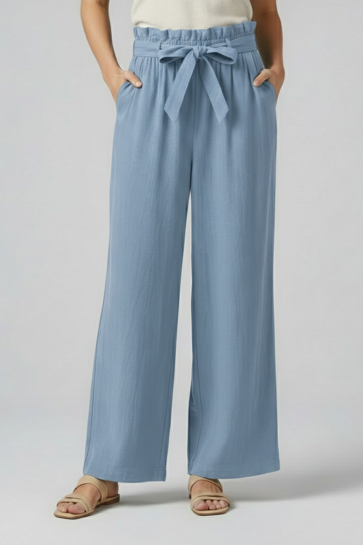 Green women’s trousers with elastic waist and tie belt by THE WHITMORE FAMILY, stylish and comfortable for everyday wear.