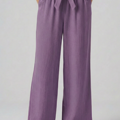 Green women's trousers with elastic waistband and tie belt from THE WHITMORE FAMILY, styled for a comfortable fit.