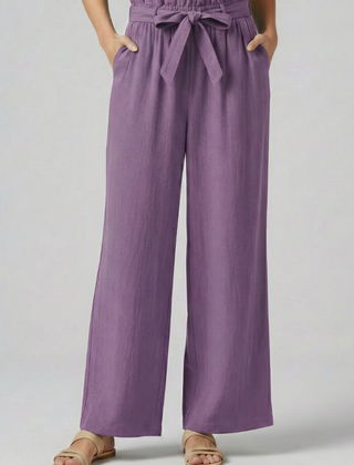 Green women's trousers with elastic waistband and tie belt from THE WHITMORE FAMILY, styled for a comfortable fit.