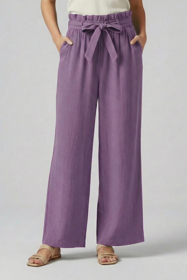 Green women's trousers with elastic waistband and tie belt from THE WHITMORE FAMILY, styled for a comfortable fit.
