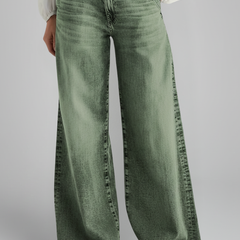 Women’s wide-leg jeans with high-rise waist and front closure from THE WHITMORE FAMILY, in green, shown on a model.