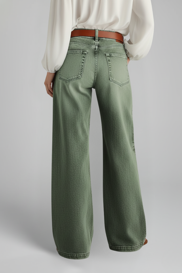 Women’s green wide-leg jeans with high-rise waist and front closure, from THE WHITMORE FAMILY, shown on a model.