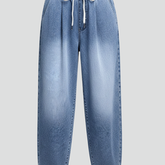 Women's cropped trousers with drawstring waist and pleats from THE WHITMORE FAMILY, shown in a relaxed fit with stylish details.