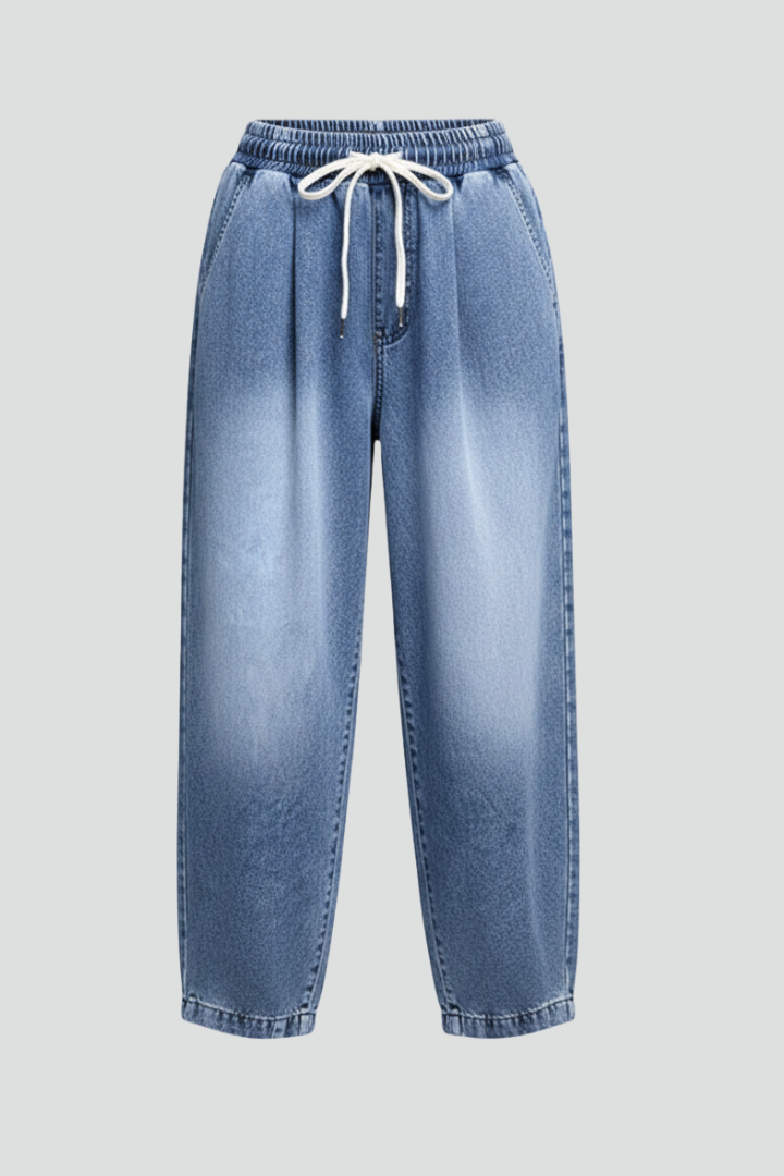 Women's cropped trousers with drawstring waist and pleats from THE WHITMORE FAMILY, shown in a relaxed fit with stylish details.