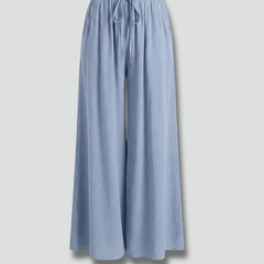 Light blue women’s palazzo trousers with drawstring waist and side pockets by THE WHITMORE FAMILY.