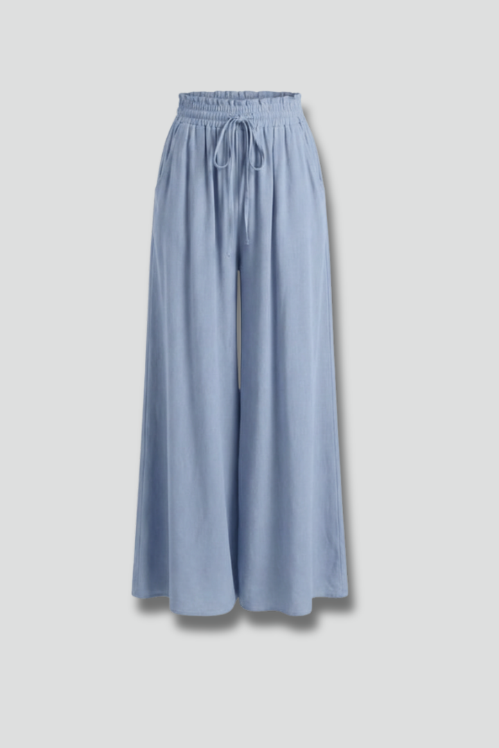 Light blue women’s palazzo trousers with drawstring waist and side pockets by THE WHITMORE FAMILY.
