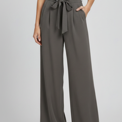 Light blue women’s palazzo trousers with drawstring waist and side pockets by THE WHITMORE FAMILY.