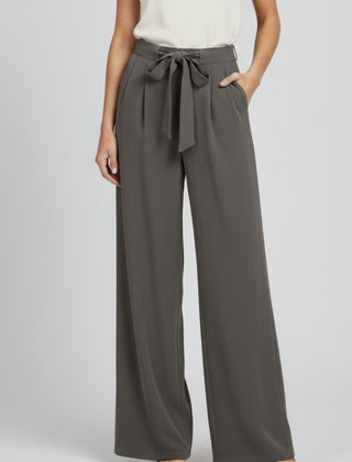 Light blue women’s palazzo trousers with drawstring waist and side pockets by THE WHITMORE FAMILY.