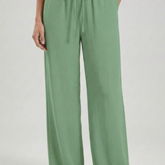Light blue women’s palazzo trousers with drawstring waist and side pockets by THE WHITMORE FAMILY, casual and comfortable fit.