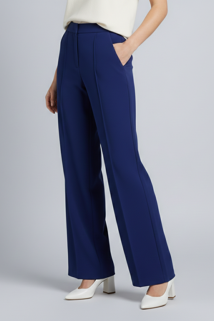 Navy blue women’s palazzo trousers with high waist and pleats from THE WHITMORE FAMILY, featuring a wide-leg design.