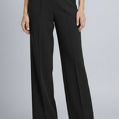 Navy blue women's palazzo trousers with high waist and pleats by THE WHITMORE FAMILY, styled for a relaxed, elegant look.