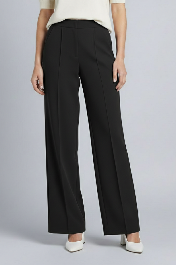 Navy blue women's palazzo trousers with high waist and pleats by THE WHITMORE FAMILY, styled for a relaxed, elegant look.