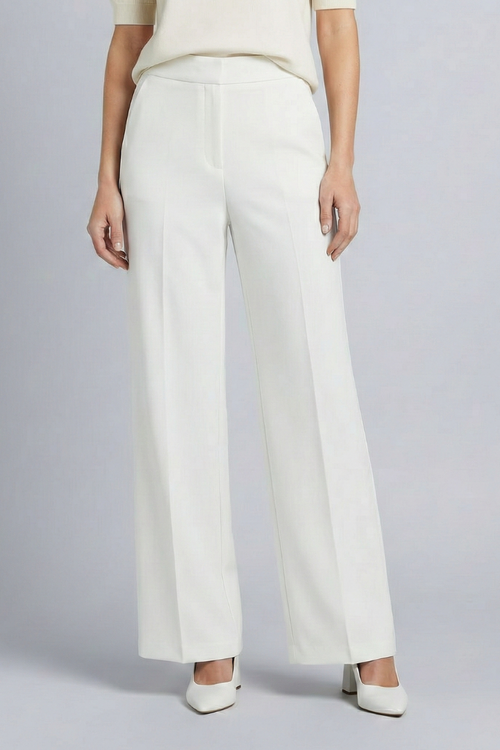 Navy blue women's palazzo trousers with high waist and pleats by THE WHITMORE FAMILY, featuring a relaxed, flowing fit.