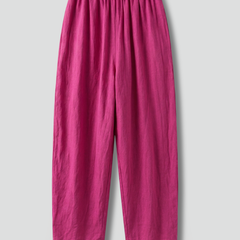 Women’s pink trousers with elastic waistband and wide-leg style from THE WHITMORE FAMILY, shown flat on a white background.
