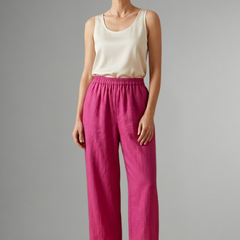 Pink women’s trousers by THE WHITMORE FAMILY with elastic waistband and wide-leg design, casual and comfortable for everyday wear.