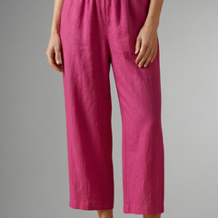Pink women’s trousers with elastic waistband and wide-leg design from THE WHITMORE FAMILY, perfect for casual and stylish wear.