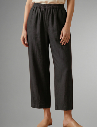 Pink women's trousers with elastic waistband and wide-leg fit from THE WHITMORE FAMILY, casual and comfortable for everyday wear.