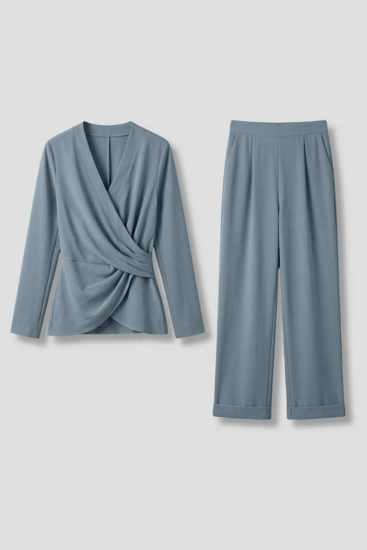 Women’s two-piece set by THE WHITMORE FAMILY featuring a wrap top and cropped trousers, styled for casual or chic wear.