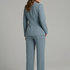 Women’s two-piece set with wrap top and cropped trousers by THE WHITMORE FAMILY, styled for casual or chic occasions.