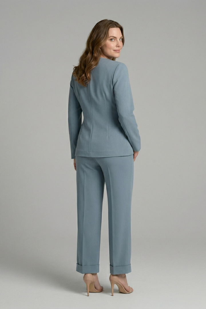 Women’s two-piece set with wrap top and cropped trousers by THE WHITMORE FAMILY, styled for casual or chic occasions.
