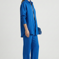 Women's beige two-piece set by THE WHITMORE FAMILY featuring a button shirt and straight trousers, casual and stylish.