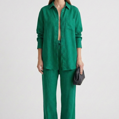 Beige women’s two-piece set with button shirt and straight trousers from THE WHITMORE FAMILY, styled for casual or office wear.