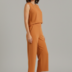 Women’s beige two-piece set from THE WHITMORE FAMILY featuring a sleeveless top and cropped trousers, casual and stylish.